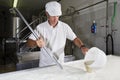 Cheesemaker pours rennet Royalty Free Stock Photo
