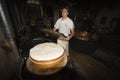 A cheesemonger in a ancient dairy, Franche-ComtÃÂ©, France