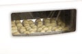 Cheesepuffs baking in oven (Recipe series) Royalty Free Stock Photo