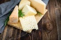 Cheeses with basil and rosemary. Royalty Free Stock Photo