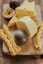 cheeses, rosemary and passion fruit.milk fat and Milk products. Cheese board set. assorted cheese board with herbs and Royalty Free Stock Photo