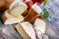 Cheeses and Tomme de Savoie with beer, French cheese Savoy, french Alps France Royalty Free Stock Photo