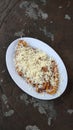 Cheesy Bliss: Savoring Crispy Banana Fritters with Shredded Cheese