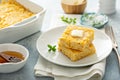 Cheesy cornbread freshly baked served with butter