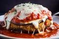 Cheesy Eggplant Parmesan with a Crispy and Flavorful Breading, Layered with Zesty Tomato Sauce