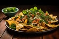 cheesy nachos garnished with fresh cilantro leaves