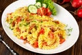 Cheesy Noodle Omelette with Tomatoes and Bacon on wooden Background