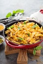 Cheesy pasta bake with ground beef and herbs