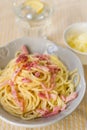 Cheesy pasta spaghetti with cheese and cream served with fried bacon