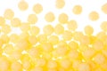 Cheesy snack - corn sticks balls as fun food pattern, background. Top view. Royalty Free Stock Photo