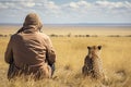 Cheetah sits on the back of a man in the savannah, rear view of Photographer taking picture of cheetah in Masai Mara, Kenya, AI Royalty Free Stock Photo