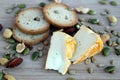 Cheeze snack with crackers and mixed nuts on a wooden board