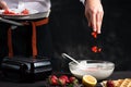 Chef adding fruit in waffles dough Royalty Free Stock Photo