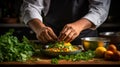 A chef adds fresh cilantro and mint leaves to a curry dish