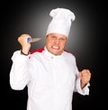 Chef angry and swinging knife in the air Royalty Free Stock Photo