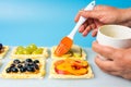 Chef applying egg on the fruit sweet pie Royalty Free Stock Photo