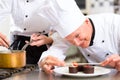 Chef as Patissier cooking in Restaurant dessert Royalty Free Stock Photo