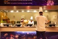 Chef and assistant Chefs cooking and prepared buffet food at restaurant in night time in Bangkok, Thailand