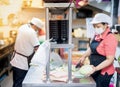 Chef and assistant prepare material food for cooking and serve in the kitchen at the restaurant