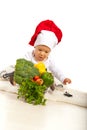 Chef baby with many vegetables