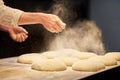 Chef or baker cooking dough at bakery