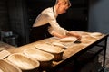 Chef or baker making dough at bakery Royalty Free Stock Photo