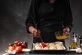 Chef or baker prepares small bread or rolls. Bakery and baking business. Cooking from dough Royalty Free Stock Photo