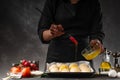 Chef or baker prepares small bread or rolls. Bakery and baking business. Cooking from dough Royalty Free Stock Photo