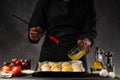 Chef or baker prepares small bread or rolls. Bakery and baking business. Cooking from dough Royalty Free Stock Photo