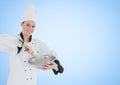 Chef with bowl against blue background Royalty Free Stock Photo