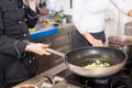 Chef or braising meat in a frying pan Royalty Free Stock Photo