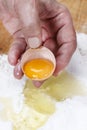 Chef breaking eggs into flou Royalty Free Stock Photo