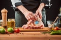 Chef brushing raw beef ribs with marinade Royalty Free Stock Photo