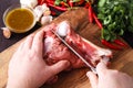 Chef Butcher cutting lamb meat with knife on kitchen, cooking proteine food Royalty Free Stock Photo