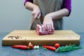 Chef Butcher cutting pork meat with knife on kitchen, cooking food Royalty Free Stock Photo