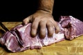 Chef Butcher cutting pork meat, knife on kitchen wooden board, cooking food Royalty Free Stock Photo