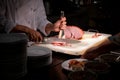 Chef Carving Slice of Italian baked ham on board, Chef hand cutting roasted ham Catering service employee cutting ham for people