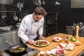 chef checking fried vegetables