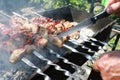 Chef checking with knife readiness of barbecue