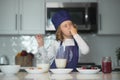 Chef child cooking healthy meal and dinner preparation. Chef kid cook baking at home kitchen. Royalty Free Stock Photo