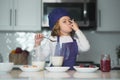 Chef child cooking healthy meal and dinner preparation. Child chef preparing healthy meal. Cute kid boy in chef uniform Royalty Free Stock Photo