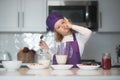 Chef child cooking healthy meal on kitchen. Child dinner preparation on kitchen. Kid chef cook is learning how to make a Royalty Free Stock Photo