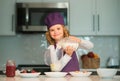 Chef child prepared ingredients. Chef child in apron and chef hat cooking at kitchen. Healthy food. Royalty Free Stock Photo