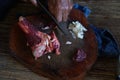 The chef is chopping the galangal, meat and bone on the chopping board to cook. Royalty Free Stock Photo