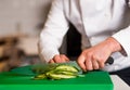 Chef chopping leek, doing preparations Royalty Free Stock Photo