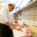 Chef chopping meat Royalty Free Stock Photo