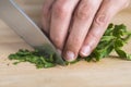 Chef chopping parsley leaves