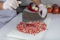 Chef is chopping the raw beef on cutting board with knife to cook in the kitchen, minced beef. Kebab restaurant, kebab preparation