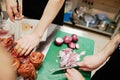 Chef chopping red onions at the cutting board Royalty Free Stock Photo