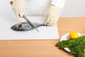 Chef cleaning fish Royalty Free Stock Photo